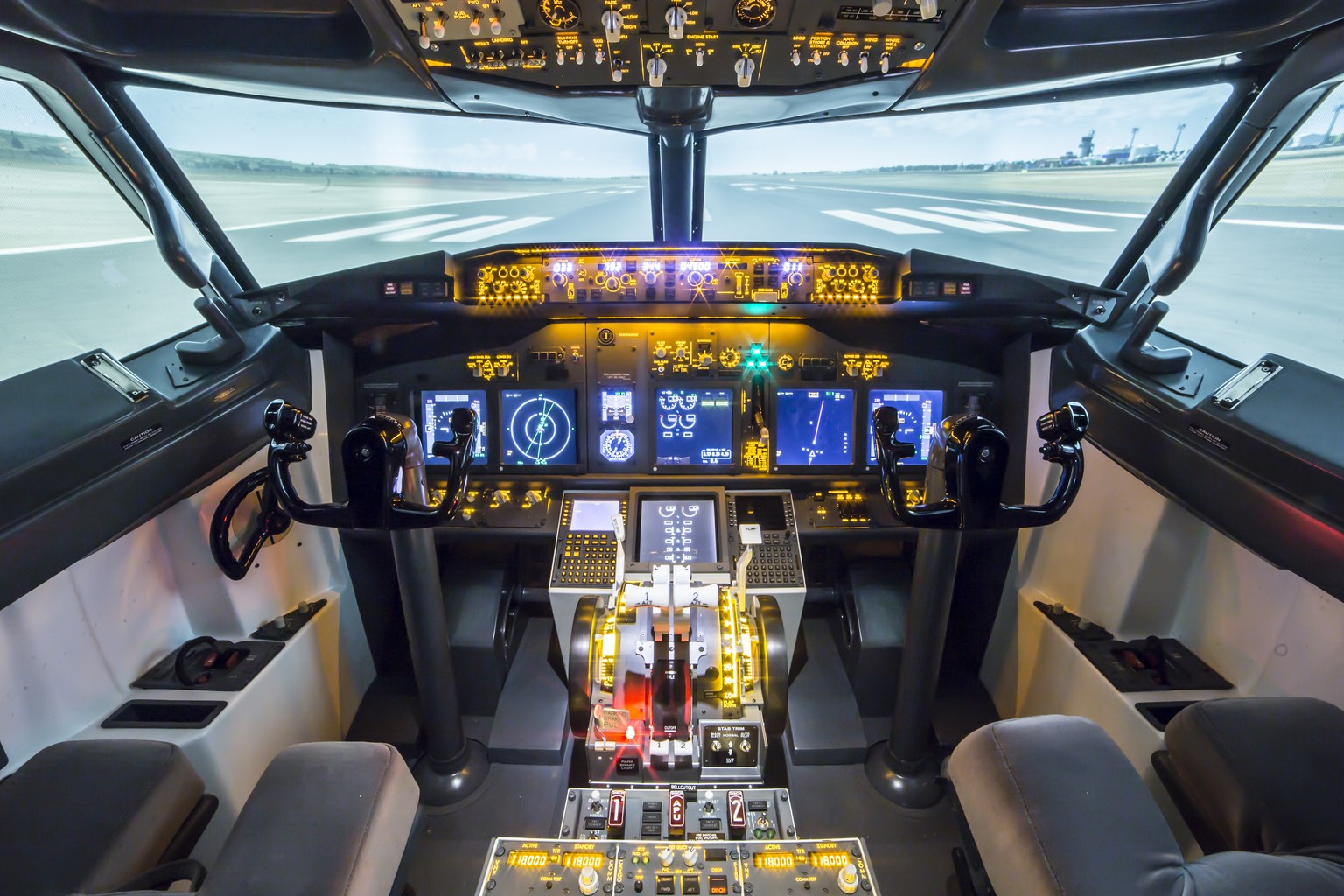 Full SISMO simulator cockpit with dual controls and runway projection